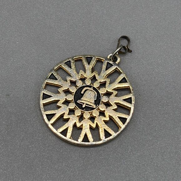 Vintage PacBell Telephone Pendant Gold Tone Bell Logo People Holding Hands - Picture 1 of 5